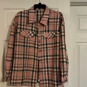 Pink, gray and tan plaid long sleeve shirt.
